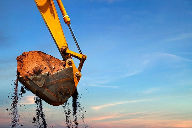 Excavator lifting dirt